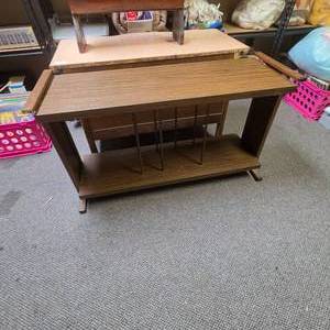 lot 35 image: Vintage Wood Laminate Console Table with Dowel Dividers  (missing one upper end cap and one dowel) - can be used for storing records between the dowels.