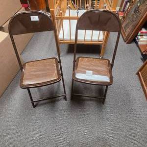 lot 36 image: Set of 2 Vintage Small Folding Chairs Brown Metal Frame with Padded Seat - one seat has duct tape on it - seats are 12.5 square with 10.5 square padding