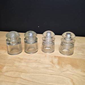 lot 116 image: Set of 4 of Clear Glass Insulators with Dome Tops and Threading - two Hemingray and two Pyrex brand