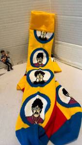lot 1006 image: Beatles Clock, Yellow Submarine Socks and magnets