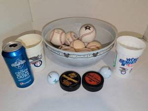 lot 2123 image: Kansas City Royals World Series with Baseballs Hockey Pucks and more