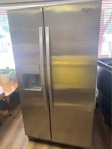 lot 1 image: Whirlpool side-by-side refrigerator for sale. Clean and in good working condition 35 34 inches wide 31 inches deep GS80