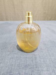 lot 729 image: Tameless Fragrance Spray Bottle Gold Tone