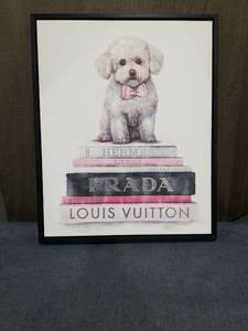 lot 1839 image: Framed Print White Dog with Pink Bow on Fashion Books Stack