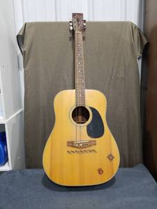 lot 1844 image: Acoustic Guitar with Decorative Body Graphics Needs New Strings