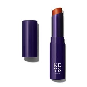 lot 4837 image: Comforting Tinted Lip Balm- Bronze Aura - Retail $18