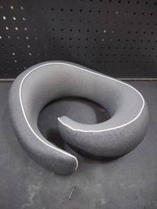 lot 6001 image: Neck pillow with curved foam design and mesh interior panel. SKU X004R7117P