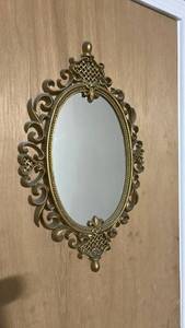 lot 60504 image: Ornate Gold Oval Wall Mirror with Scroll Frame