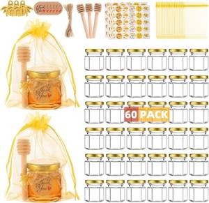 lot 442076 image: 60 Pack Mini Glass Honey Jars Party Favors,1.5 oz Small Hexagon Glass Honey Jars with Dippers,Lids,Gold Bags,Bee Charms,Thank You Cards,Jute,Cute Stickers for Baby Shower Favors,Wedding party gift