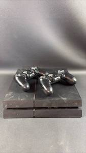 lot 7 image: PlayStation 4 and (2) Matching Controllers needs power cord, untested