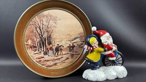 lot 8 image: Currier & Ives Winter Pastime Decorative Tin with Santa Figurine