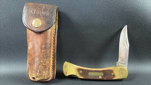 lot 10 image: Schrade Folding Knife with Leather Sheath USA made