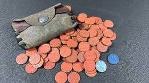 lot 31 image: World War II Office of Price Administration (OPA) red point ration tokens, used in the United States between 1944 and 1945 to make change for ration stamps when purchasing meat and dairy products. Two Blue Processed Food Points and Leather Coin Purse