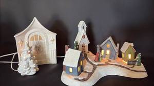 lot 54 image: Ceramic Holiday Village Figurine Set 5 Pieces Lighted Houses and Church, Plays Winter Wonderland. Ceramic Tree Decor and Welcoming Doorway.