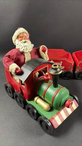 lot 95 image: Santa Claus Wood and Fabric Mache Christmas Train Decoration (Santa is 9 inches tall)