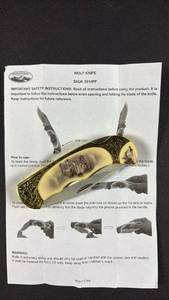 lot 110 image: NIB Woodland Creek Wolf Knife SKU 0014PP