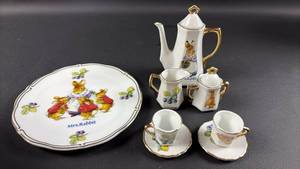 lot 117 image: Beatrix Potter Peter Rabbit Mrs. Rabbit Mini Tea Set Porcelain with Teapot Creamer Sugar Cups Saucers Plate