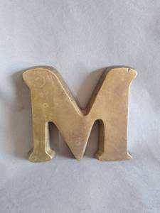 lot 184 image: Brass Letter M Decorative Figure Felt Backed
