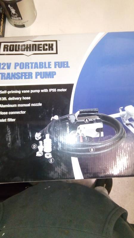 lot 7950 image: Roughneck 12V Fuel Transfer Pump  11 GPM, Manual Nozzle, Hose