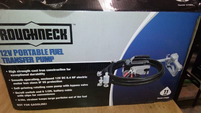 lot 7971 image: Roughneck 12V Fuel Transfer Pump  11 GPM, Manual Nozzle