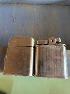 lot 103 image: Two Metal Lighters with Hinged Tops