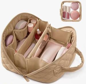 lot 28076 image: Travel Makeup Bag for Women, 2PCS Waterproof Puffer Cosmetic Bags, Large Capacity Lay-Flat Toiletry Organizer with Brush Compartment & Handle, Portable Makeup Pouch Set (Khaki) - Retail $10
