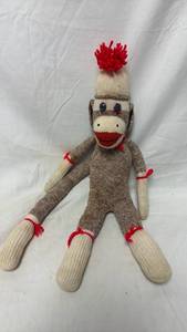 lot 49 image: 20 Sock Monkey Doll with Red Pom-Pom Hat Handmade Knit Plush Toy