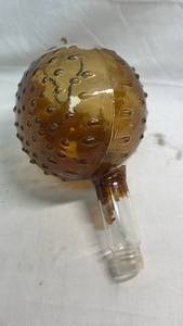 lot 66 image: Amber Glass Decorative Ornament Ball with Metal Handle