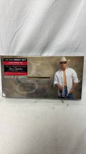 lot 74 image: Garth Brooks Time Traveler 7-Disc Boxed Set 68 Page Collectors Book