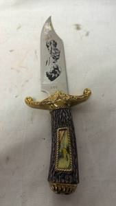 lot 321 image: Fixed Blade Knife with Plastic Eagle Head Handle and Etched Blade