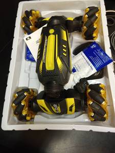 lot 1100 image: Skid Fusion Remote Control Stunt Car with Controller and Battery - Retail $49