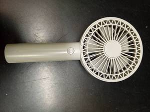lot 1109 image: Dadi Handheld Mini Fan with Handle and Power Button - Retail $11