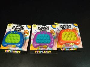 lot 1118 image: Toy Planet Pop-Pop Poppers Game 4 Game Modes Light Up Lot of 3 - Retail $0
