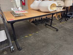lot 18636 image: Wood Lamanite Table on Casters