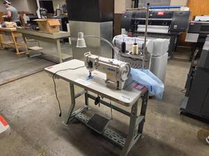 lot 18645 image: Juki Sewing Machine With Table - Model DNU-1541S