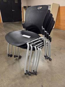 lot 20001 image: Mobile Nesting Chairs with Perforated Black Seat and Back - Set of 100