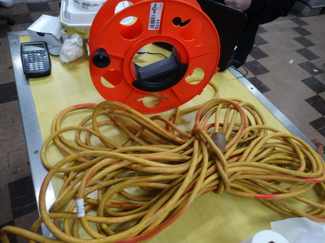lot 1170 image: Cord reel and 100 ft extension cord