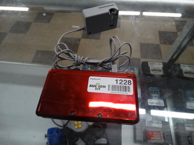 lot 1228 image: Nintendo 3 ds with power cord