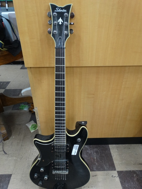 lot 1341 image: Schecter electric guitar w strap