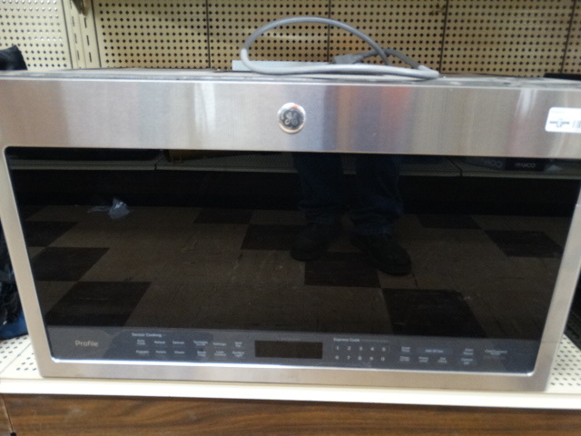 lot 1399 image: New GE above range microwave