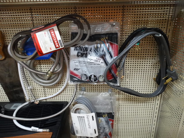 lot 1402 image: Lot of various dryer cords and washer hoses