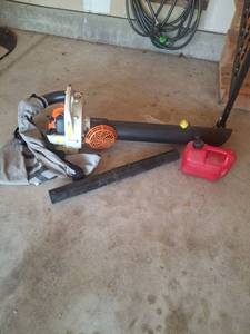 lot 1009 image: STIHL SH 55 Handheld Leaf Blower  Vac with Fuel Container