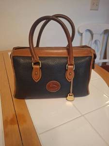 lot 1040 image: Dooney & Bourke Handbag with Matching Wallet
