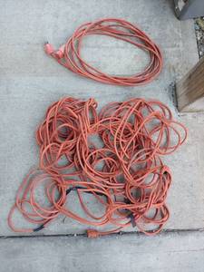 lot 2040 image: Two Orange Extension Cords