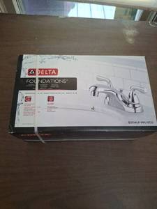 lot 1199 image: Delta Foundations Centerset Bathroom Faucet 4 Chrome