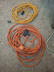 lot 1241 image: Two Extension Cords - Yellow and Orange