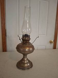 lot 1385 image: Oil Lamp with Glass Chimney and Metal Base