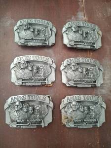 lot 1409 image: (6) Ames Tools Mount Rushmore Belt Buckles
