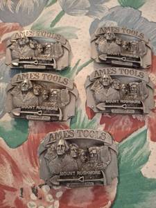 lot 1464 image: (5) Ames Tools Mount Rushmore Belt Buckles