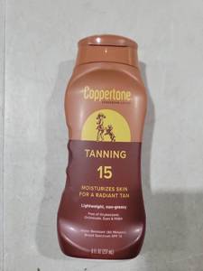 lot 5099 image: Coppertone Tanning Sunscreen Lotion SPF 15 8 fl oz